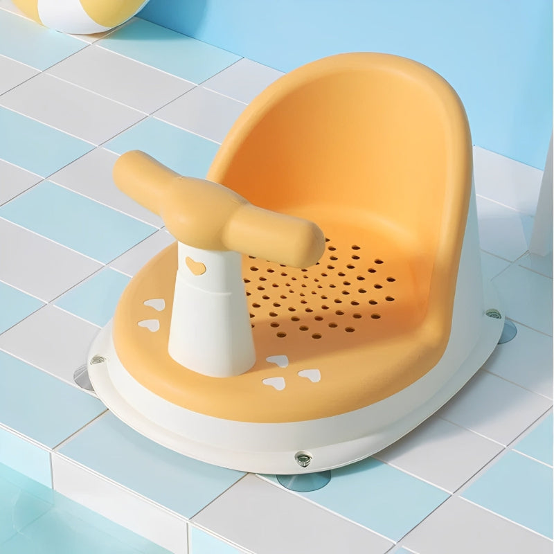 Yellow bath seat with handle on a tiled bathroom floor