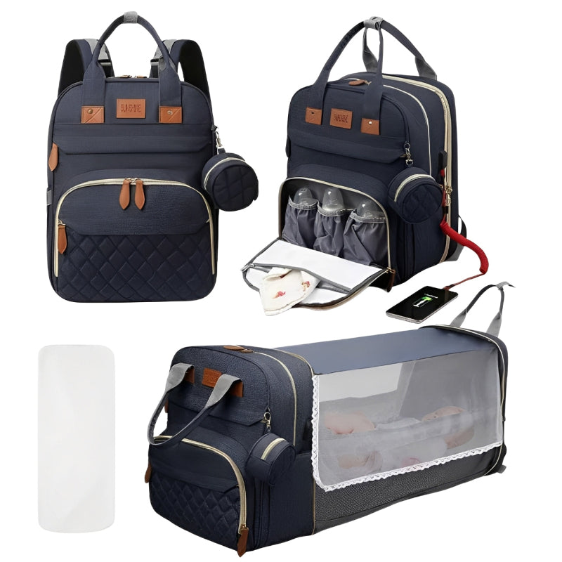Navy blue diaper bag with multiple compartments and accessories on a white background