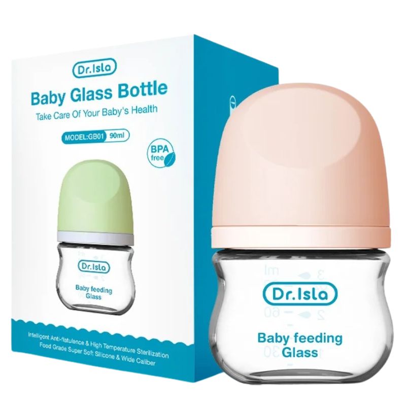 Dr. Isla baby glass bottle with pink cap and green cap next to its packaging on a white background