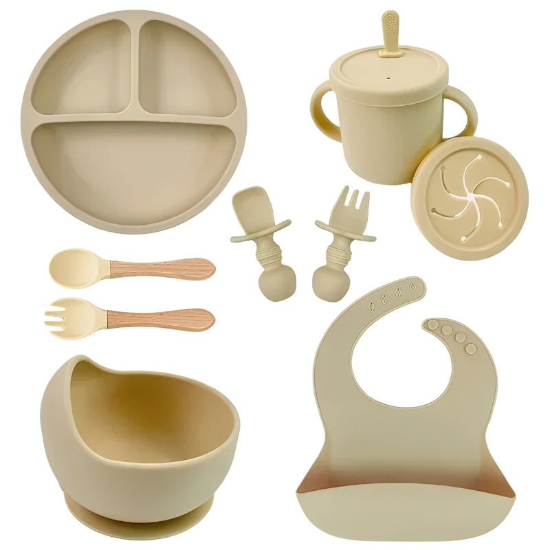 Beige baby and utensils set on a white background