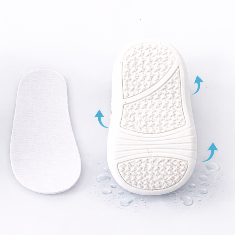White shoe insole with textured surface on a light gray background