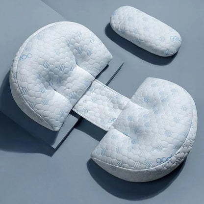 Set of three white pillows with quilted texture on a gray background