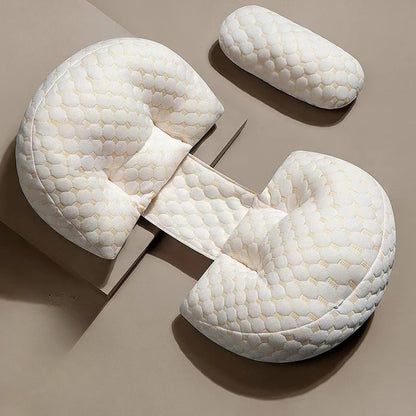 White U-shaped pillow with textured surface on a beige background